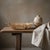 Handwoven from sustainably harvested iraca palm, this artisan basket showcases the intricate openwork weaving that has...