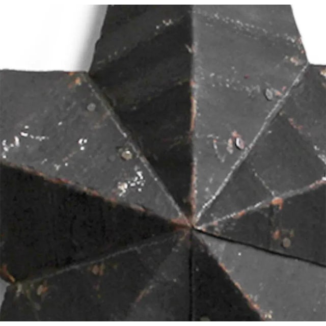 Vintage black barn star made from recycled galvanized metal roofing with a rustic aged painted patina. Industrial...