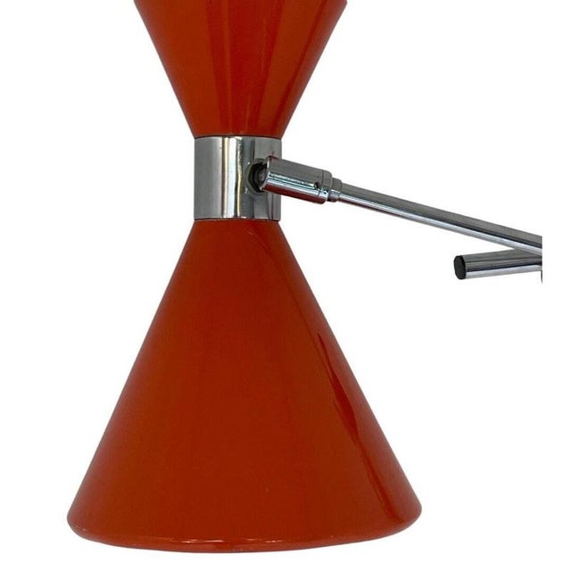 Vintage wall mounted fixture made by the Dutch company called Herda. The shape resembles the shape of a diabolo (the...