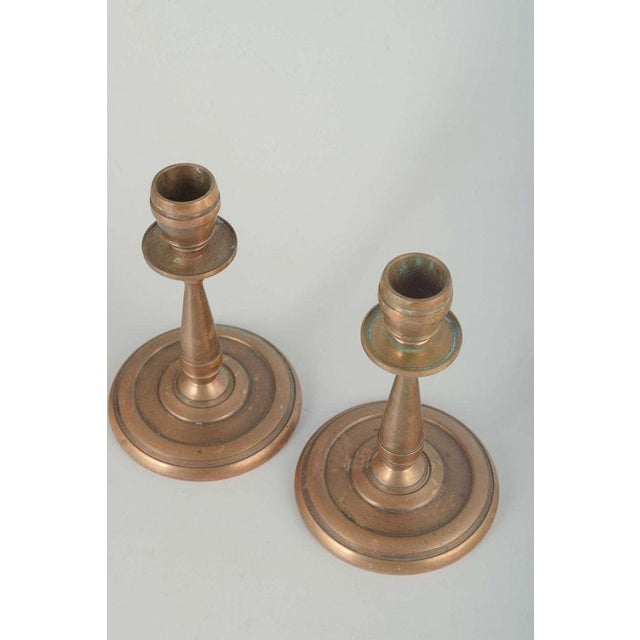 Cawa, denmark pair of brass candlesticks, art deco, 1940s. solid brass candlesticks with circular base and geometric ring...