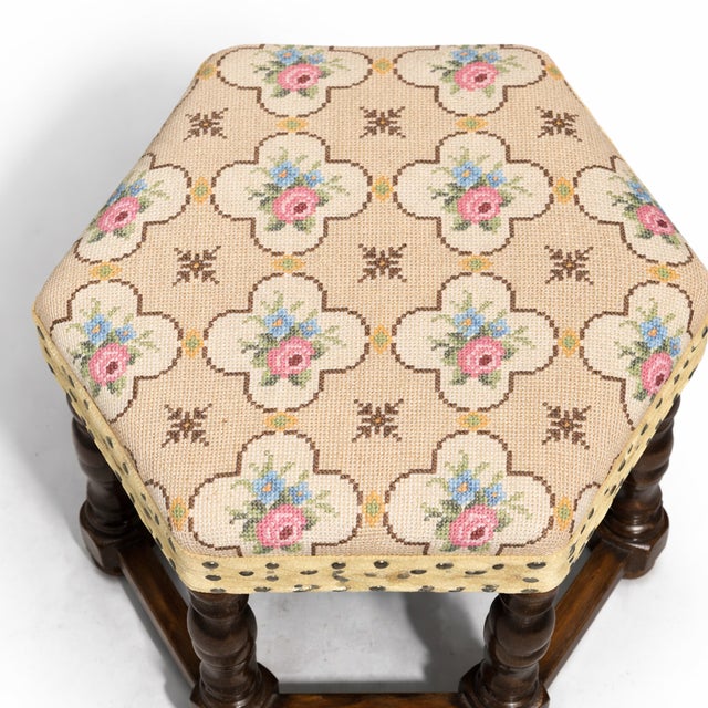 A charming Danish oak stool featuring classic barley twist legs and stretcher base construction. The square upholstered...