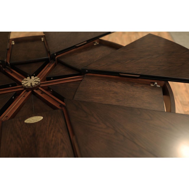 64 to 84 Round Transitional Ebonized Oak Jupe Table With Self-Storing Leaves Seats 6-10 People For Sale In New York - Image 6 of 11