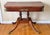 Antique flip-top convertible console to game table. The top can be rotated and flipped to reveal a felt-lined game...