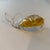 This is a vintage MCM Murano-style hand-blown glass whale paperweight featuring an amber-colored body.