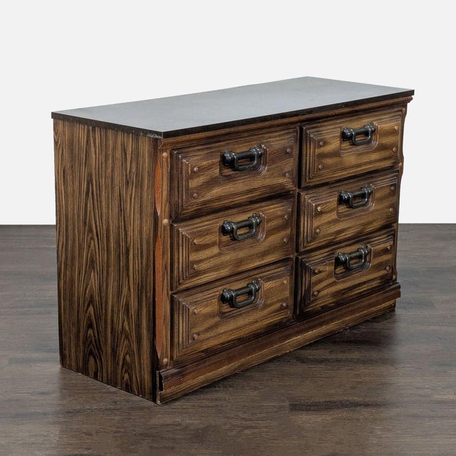 This vintage wooden dresser offers six spacious drawers, perfect for organizing clothes, accessories, or household items....