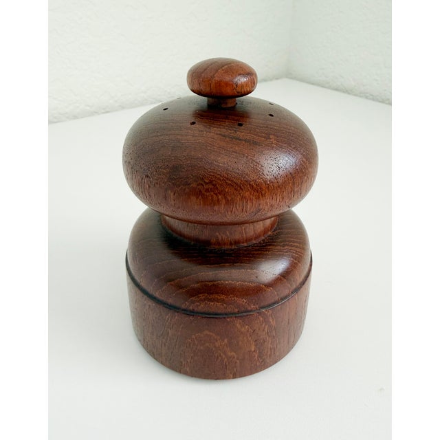 A mid-century, Jens Quistgaard-designed salt shaker and pepper grinder combination produced by Dansk Denmark from the late...