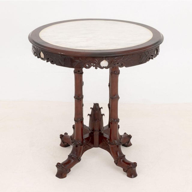 Victorian Chinoiserie Style Mahogany Center Table, with white alabaster inset circular top above bamboo motif supports....