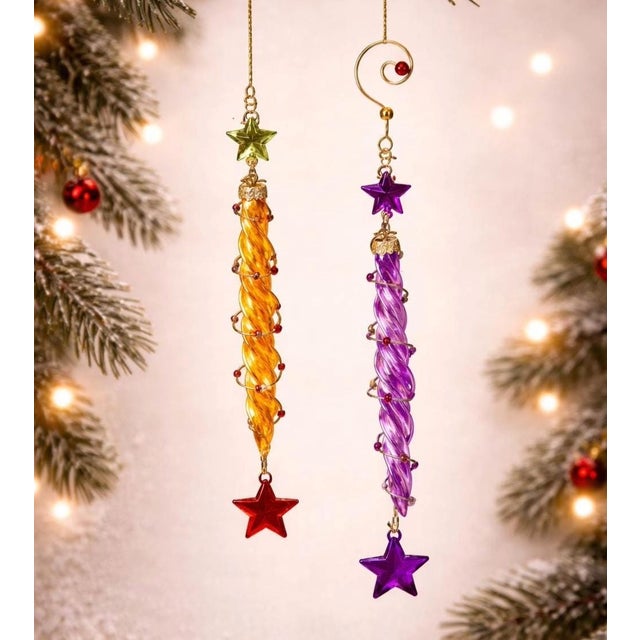 A whimsical pair of vintage glass icicle ornaments in vibrant yellow and purple hues. Each ornament features a charming...