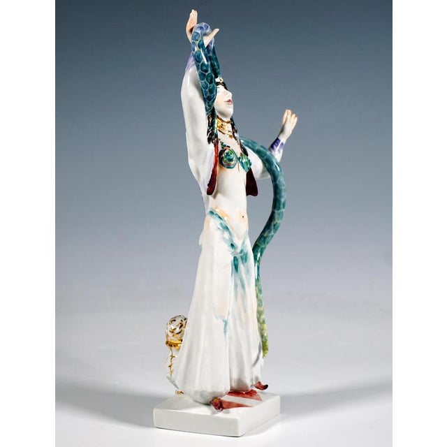 Excellent meissen porcelain figurine: female acrobat with long dark hair and tall headdress, wearing a skimpy bustier...