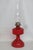 This beautiful Mid Century Oil Lamp is made of glass with a brass burner. The main body features a vibrant ruby red color...