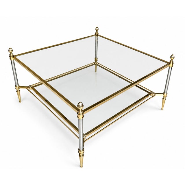 Graceful in proportion and quietly luxurious, this rare Maison Jansen coffee table reflects the refined neoclassical...