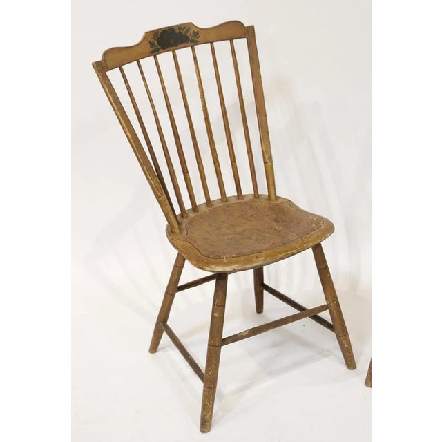 Pair of early paint-decorated chairs.
