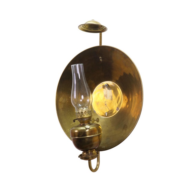 Vintage AA Imports John Scott style brass wall hanging oil lantern sconce featuring a kerosene lamp with glass chimney and...