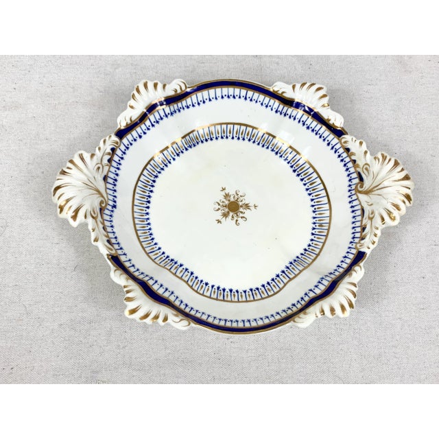 Beautiful antique serving dish. Intricate gold and blue hand painted detailing. Lovely scroll designs on the handles and...