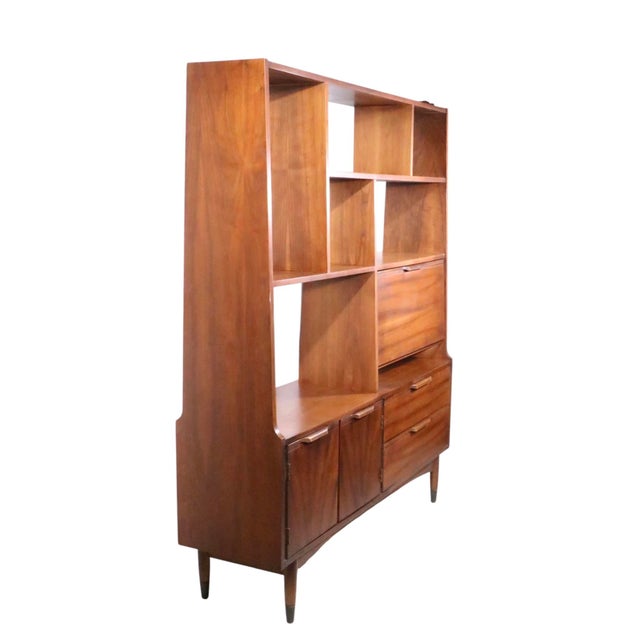 Classic Mid Century Wall Unit, Room Divider, featuring open storage on top, a drop front desk cabinet, over a base with a...
