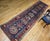 "This exquisite Persian Heriz Serapi runner, dating from the late 1800s, showcases a timeless geometric design on a...