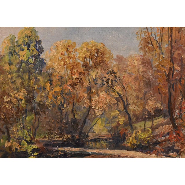 This charming oil painting by Oliver J. Crobet (1886-1969) captures the serene beauty of a woodland stream in autumn. The...