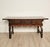 A chestnut trestle/library table, Italy or Spain circa 1720. Front shaped apron matches the drawers and legs in color. The...