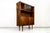 This mid-century display cabinet was produced in the 1960s by Bytomskie Fabryki Mebli, Poland as part of the “Syrius” type...