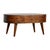This softly rounded coffee table brings warmth and approachability to the living room. Crafted from solid mango wood in a...