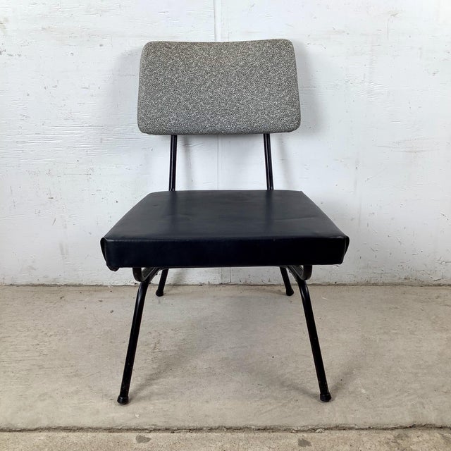 Clean. Spare. Perfectly resolved. This vintage mid-century modern iron rod side chair is exactly the kind of piece that...
