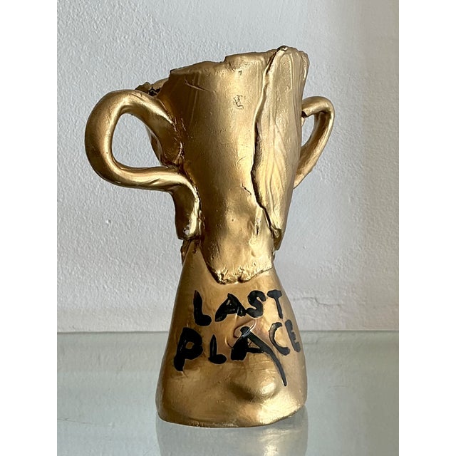 This vintage ceramic trophy brings a wonderful dose of humor to any shelf or desk, playfully honoring a "Last Place"...