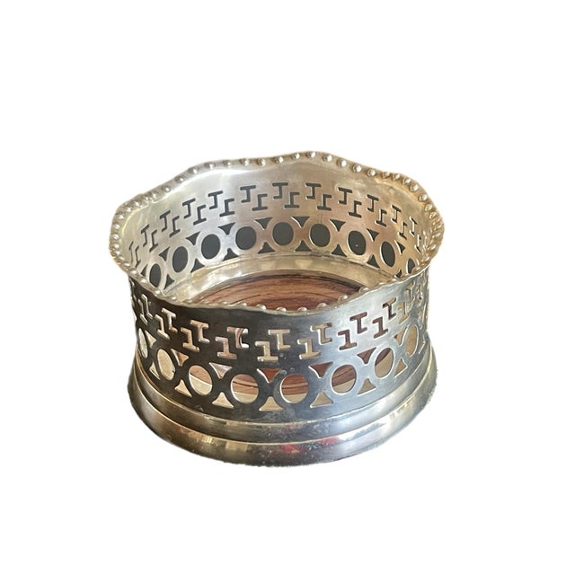 English Sheffield wine coaster with turned mahogany base. Circa 19th century.