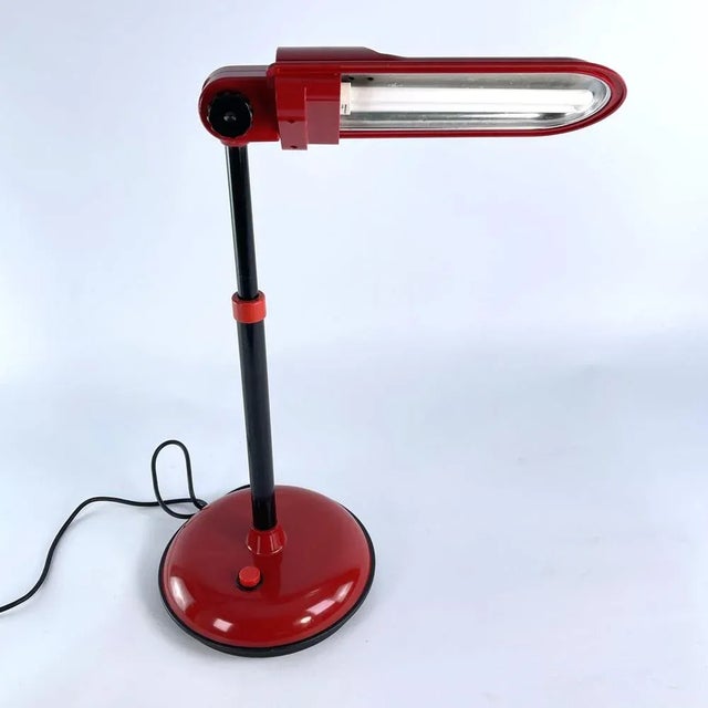 red MAZDA table lamp This rare, original table lamp from the well-known MAZDA company impresses with its simple and...