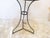 This French cafe table has weathered paint, green on the legs and gray on the top. It is 28"H x 20"D.