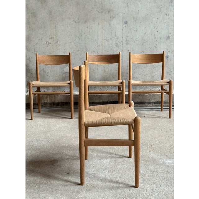 Set of 4 dining chairs model CH36 designed by Hans J Wegner for Carl Hansen & Son, Denmark 1960's. The frame of the chairs...