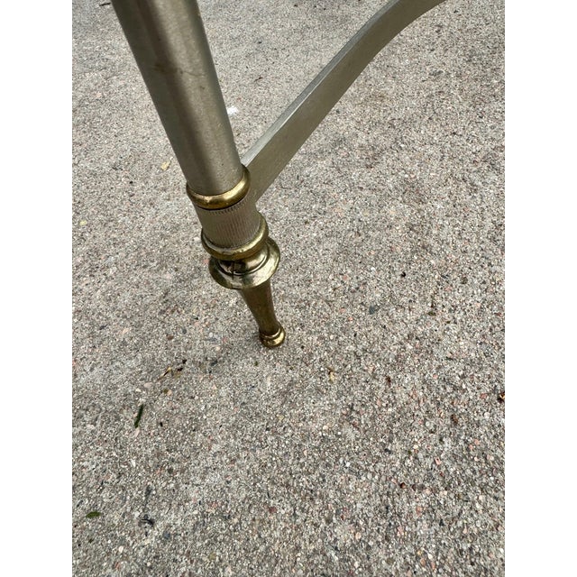 20th century steel and brass coffee table with clean neoclassical lines. Removable glass top with an attractive one inch...