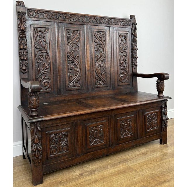 Bring timeless character to your home with this Antique French Oak Monks Bench , beautifully crafted with richly carved...