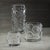 A striking fusion of texture and elegance, the Celeste Glass Candle Holder makes a captivating statement in any setting....