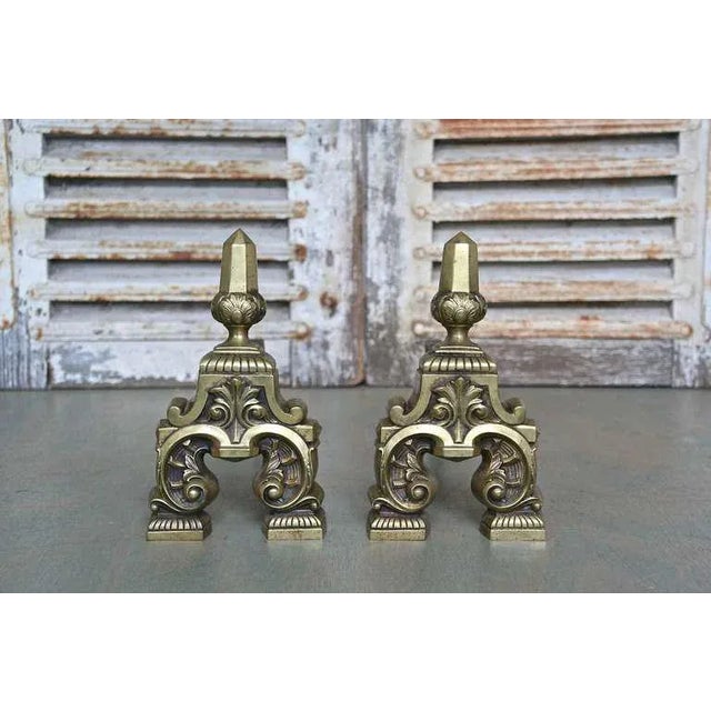 Pair of highly decorative French mid century brass and bronze andirons. Good vintage condition. Ref #: Dimensions: 11"H x...
