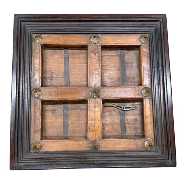 Dimensions: 37" W x 37" D x 18.5" H Add a touch of history and rustic charm to your living space with this unique coffee...