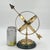 Classic mid to late 20th century brass armillary sphere on a heavy, solid green marble base, featuring a brass sundial...