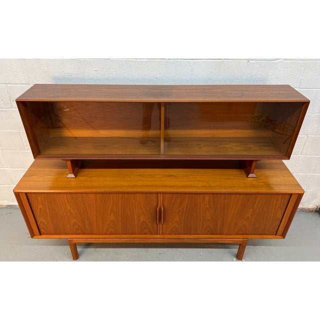 Elevate your space with this Danish mid-century modern teak server with hutch top, a sophisticated piece that seamlessly...
