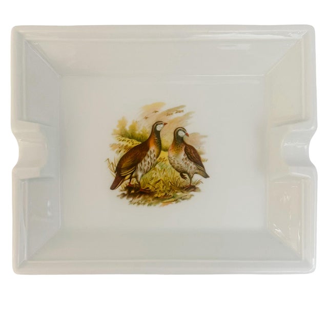 Made in a classic French country style, this beautiful rectangular porcelain cigar or cigarette ashtray features a vibrant...