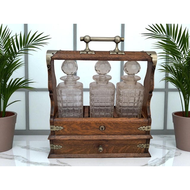 Original victorian oak & brass tantalus with crystal decanters – c.1880s presenting a beautifully crafted victorian...