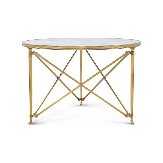 Early 19th-century French design anchored by a sleek quartz top with a refined moulded surround and elegant canted...