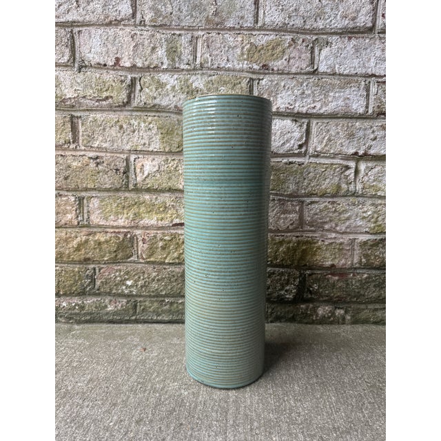 Tall turquoise ceramic ribbed pottery vase. This piece is highly textured and porous as well as being ribbed. It is a...