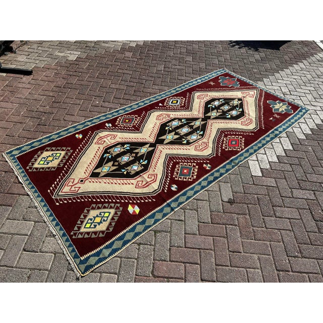 This beautiful, vintage, handwoven kilim is approximately 60 years old. It is handmade of very fine quality wool and...