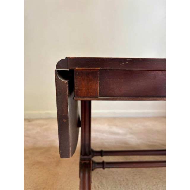 Vintage Dark Wood Table with leather top in rich mahogany will add an understated elegance to any room that it’s placed...