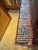 A matched pair of American folk art tramp art mirrors, each frame built from layers of chip-carved notched wood in...