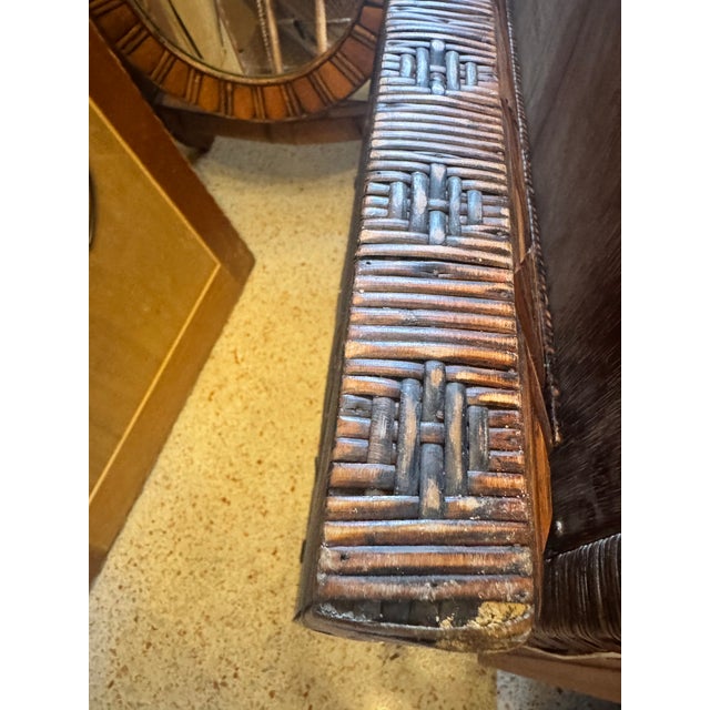 A matched pair of American folk art tramp art mirrors, each frame built from layers of chip-carved notched wood in...