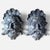 A striking, monumental pair of vintage cast iron wall plaques depicting the mythological face of Neptune (or Poseidon),...