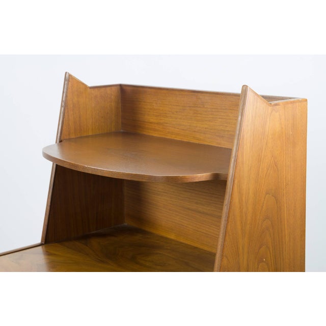 A stunning figured walnut night stand by Kipp Stewart for the Drexel Declaration line. The top shelf floats above two...