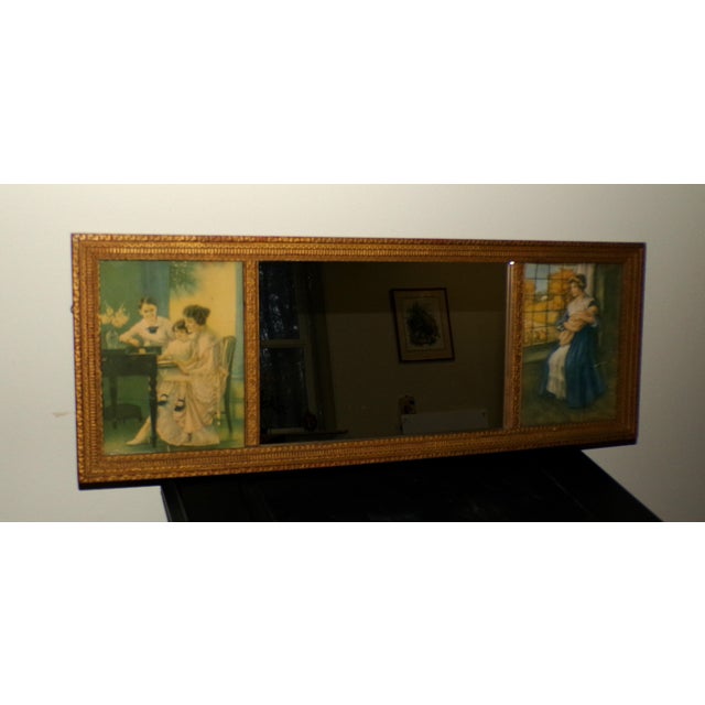 Antique tryptic tripart framed mirror featuring two prints flanking a central mirror panel, early 20th century. The prints...