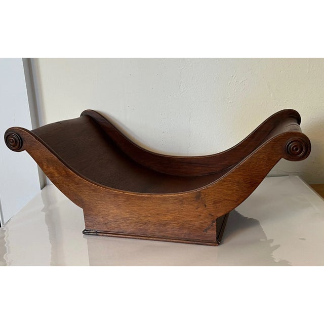 Mahogany cheese sleigh. Originally intended to hold large rounds of cheese, these trays now are used as centerpieces on...