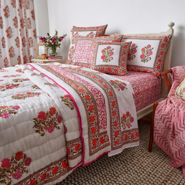 The Sanya-Riyad design is an instant eye-pleaser in the celebrated Indian color palette of pink and orange. The multi-...